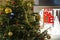 detail of Christmas tree and shop window with final sale sign, Prague, Czech Republic