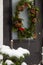Detail of a Christmas wreath in a black door