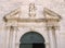 Detail of the church entrance door, Facade of old church in Omis