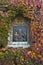 Detail from a church wall, Virgin Mary with Jesus Christ surrounded with autumn leaves at Kalemegdan, Belgrade