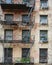 Detail closeup of an old building and fire escape in lower Manhattan