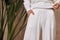 Detail of clothes woman beautiful sexy  wear white cotton knitted suit fashion style for casual collection accessory interior sand