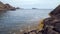 Detail of the coastline, seaweed and rock formations in the Tudela Natural Park