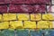 Detail of colored brickwall in red, yellow and blue