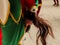 detail of the colorful harlequin dancer dressed with a ponytailed stick at the festivities in burgos