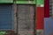 Detail of colourful facade showing closed old door