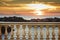 Detail of a concrete italian balustrade against a calm sea - concept image