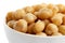 Detail of cooked chickpeas in white bowl.