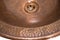 Detail of copper round sink. Brown copper sink in retro style. Antique sink for home. Macro shooting.