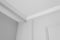 Detail of corner ceiling cornice with intricate crown moulding
