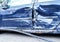 Detail of crashed car after accident, blue metal plates on side door deformed