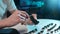 Detail cropped shot of unrecognizable man cleaning dirty space button of disassembled keyboard using cotton bud on