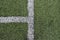 Detail of crossed white lines on football playground