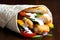 Detail of crumbed fried chicken and salad tortilla wrap with white sauce on dark background.