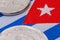 Detail of Cuban coin and flag