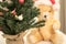 Detail on decorated Christmas Tree with Teddy Bear in the background