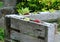 Detail of decorated composter with organic waste from pallets