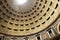 Detail of decorated unreinforced concrete Dome of the Pantheon, Rome, Italy with central opening (oculus)