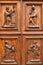 Detail of decorative carved panels on a beautiful timber door on the exterior of building
