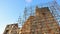 Detail of dense scaffolding used for restoration of medieval castle Hrusov, central Slovakia. Winter afternoon sunshine.