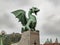 Detail of the Dragon Bridge in Ljubljana, Slovenia, on an autumn day, against the cloudy sky