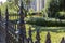 Detail of elaborate wrought iron fence in a residential neighborhood, selective focus