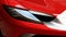 Detail of elegant sleek headlights of italian plug-in hybrid sports car Ferrari 296 GT scheduled to release in 2022