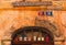 Detail of entrance into Lazy River Hostel in historic part of the Loket town. Different cups stand on the shelf above front door