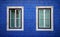 Detail of the facade of a building with blue tiles and window