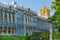 Detail of the facade of the Catherine Palace with the church steeple in the royal village.