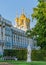 Detail of the facade of the Catherine Palace with the church steeple in the royal village.