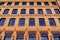 Detail of the facade of a modern loft-style office building, rebuilt from an old steam mill