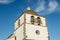 Detail of the facade and singular dome of the bell tower with its arches of the Mother Church of PedrogÃ£o Grande PORTUGAL