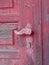 Detail of Faded Red painted Old Wood Door