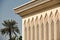 Detail of the famous Cultural center building in Sharjah against a blue sky on a sunny day