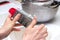 Detail of female hands grate cheese. Women prepare cheese in the kitchen for pizza or pie.Baking concept