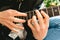 Detail of the fingers of a guitarist placed on the fret of the mast of the guitar playing a chord doing Tapping