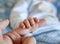 Detail of the fingers of a newborn, especially the nails.