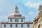 Detail of the Finisterre Lighthouse, on the Camino de Santiago route. In the light of day, in a sky with clouds. Galicia, Spain