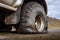 Detail of a flat black offroad tire on a offroad truck vehicle