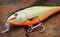 Detail of floating balsa wood fishing lure Shad Rap plug