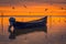 Detail of flying gulls birds above a lake with a motorized fishing boat in the foreground shot at sunrise