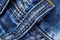 Detail four belt loops on blue jeans