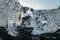 Detail of a glacial fragment of ice at Jokulsarlon glacier black