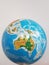 A detail of a globe focused on Australia