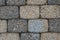 Detail of ground bricks with dried leaves in cracks