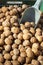 Detail of a group of natural walnuts sold in bulk at a street market