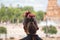 Detail of hairstyle of young teenage woman with pink carnations in her hair. Flamenco concept, dance, art, typical Spanish dance,