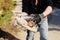 Detail of hand of an environmental volunteer picking up trash and plastic abandoned in nature