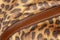 Detail of handbag with stitching on background of genuine leather, bright color of exotic skin of jaguar. Shopping concept,